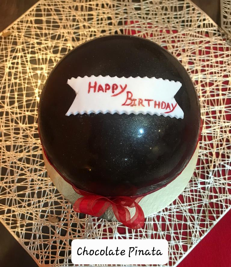 Pinata cakes filled with chocolates or cake in dark / white chocolate with hammer